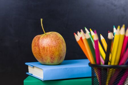 Back to school. Items for the school on a wooden table.の写真素材