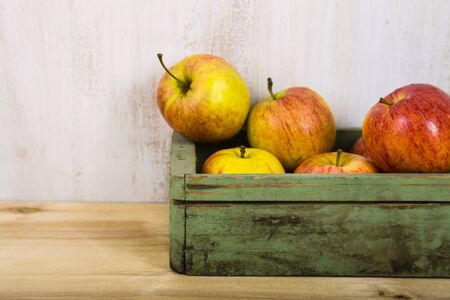 Apples in a wooden box. Concept of diet and healthy lifestyle.の写真素材