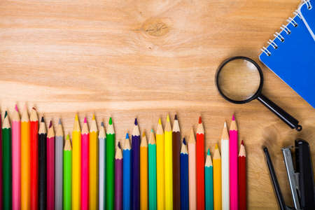 Back to school. Items for the school on a wooden table.の写真素材
