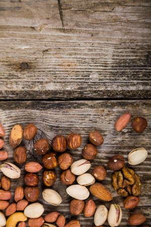 Different kinds of tasty and healthy nuts.の写真素材