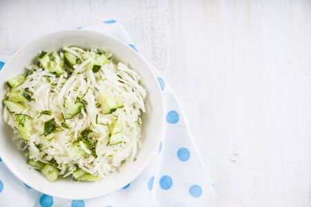 Salad with kohlrabi, cucumber and dill. Vegetarian food. Tasty and healthy dish. Healthy eating.の写真素材