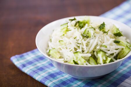 Salad with kohlrabi, cucumber and dill. Vegetarian food. Tasty and healthy dish. Healthy eating.の写真素材