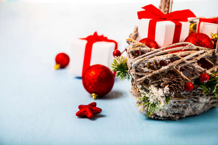 Basket with Christmas presents on a blue background. Congratulations on New Year or Christmas.の写真素材