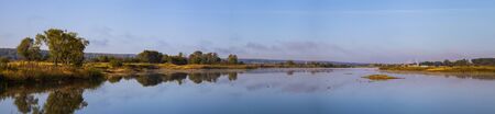 Beautiful landscape. Lake early in the morning with a fog. Panorama.の写真素材