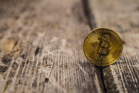 Bitcoin on an old wooden table. Ð¡oncept of e-commerce.の写真素材