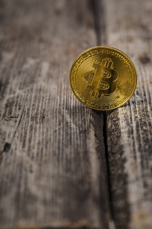 Bitcoin on an old wooden table. Ð¡oncept of e-commerce.の写真素材