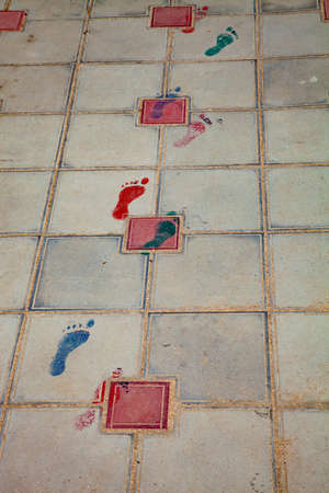 Painted traces on the sidewalk. Texture of paving slabs.の写真素材