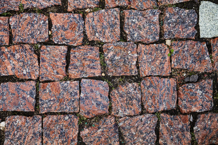 Stone road close up. Fragment of a walkway in the park.の写真素材