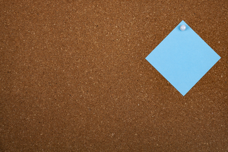 One sheet of paper on corkboard. Place for your text.の写真素材