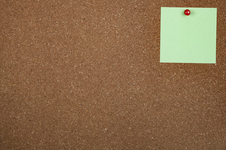 One sheet of paper on corkboard. Place for your text.の写真素材