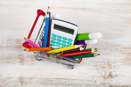 Items for school in a shopping cart. Back to school.