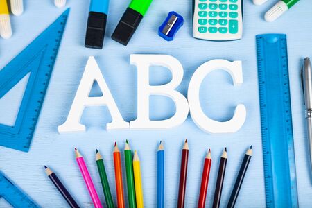 Back to school. Items for the school and letters ABC on a wooden table.の写真素材