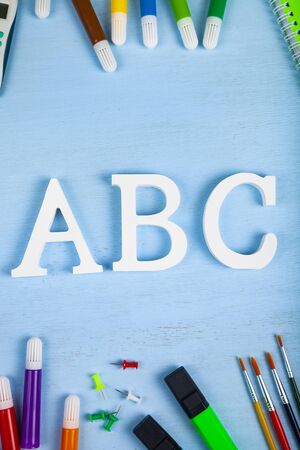 Back to school. Items for the school and letters ABC on a wooden table.の写真素材