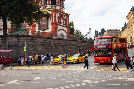 Moscow, Russia - August 14, 2019: Yellow taxi stand in front of  zebra near St. Basil's Cathedral. The road near Red Square in Moscow.のeditorial素材