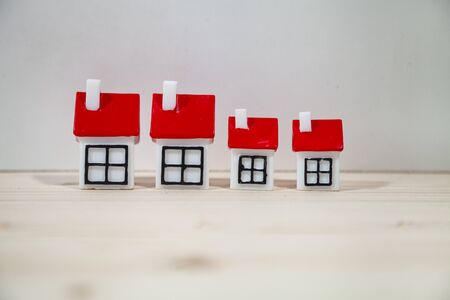 Small houses with red covers.Concept: buying, selling and renting real estate.の写真素材
