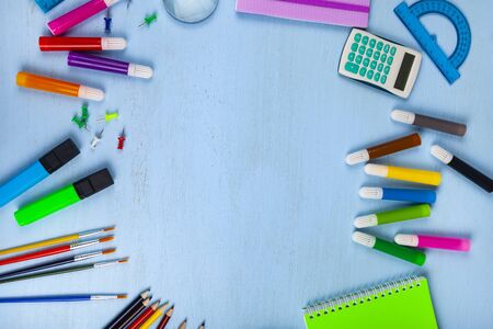 Back to school. Items for the school on a wooden table. Place for your text.