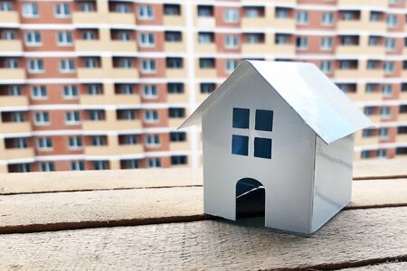 House on the background of a building under construction. Buying a property.の写真素材