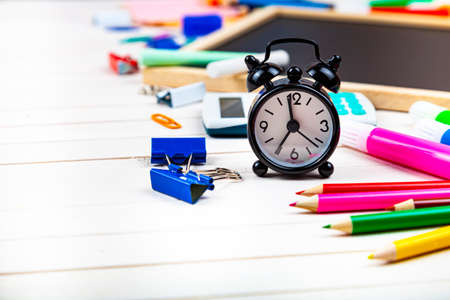 Various school supplies on a wooden table. Back to school. Stationery.
