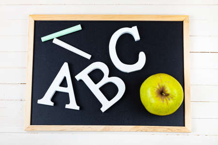 Letters ABC and chalk board. Back to school. Stationery.
