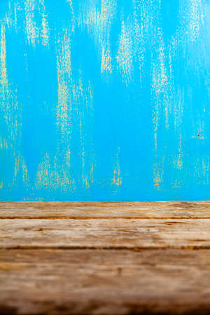 Wooden background. Beautiful brown old boards and blue wall. Beautiful background for your photo.