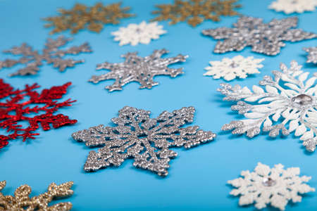Snowflakes on a blue background. Christmas background.の写真素材