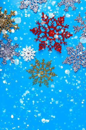 Snowflakes on a blue background. Christmas background.の写真素材