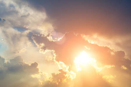 Beautiful blue sky with clouds and sunbeams. Heavenly landscape.の写真素材