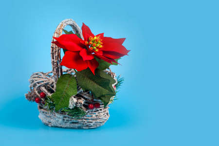 Christmas star in a beautiful basket on a blue background. Christmas decor.の写真素材
