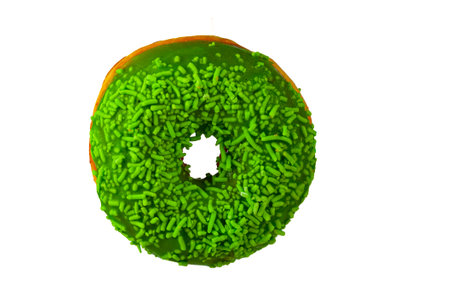 Delicious donut with green glaze isolated on white background.の写真素材