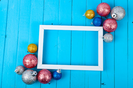 Frame and Christmas decor on a blue background. Christmas card. Place for your text.の写真素材