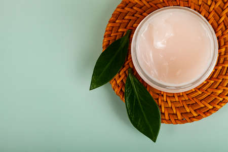 SPA natural organic cosmetics for personal hygiene. Skin cream and oil in cosmetic bottles, green...