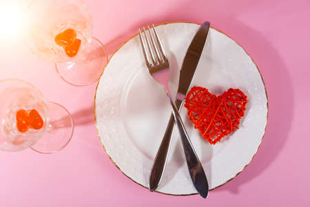 Valentine's day romantic dinner with red hearts on pink background. Flatleyの写真素材