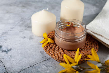 natural organic eco cosmetics. SPA beauty salon branding mockup. Cosmetic containers with cream and lotion and spring flowers on a marble background.の写真素材