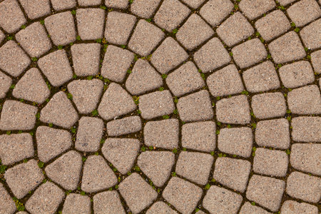 Abstract background of old cobblestone pavement close-up.の写真素材
