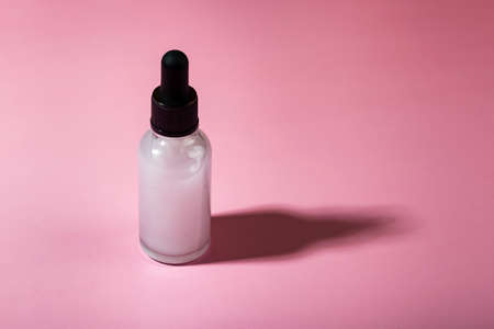 natural organic eco cosmetics. SPA beauty salon branding mockup. Cosmetic container with cosmetic product on a pink background.の写真素材