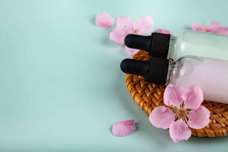 Funny green cup with eyes on a lilac background. False eyelashes are glued to the mug.の写真素材
