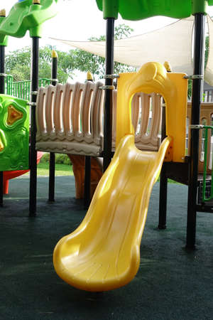 Yellow Slide on kids playgroundの写真素材