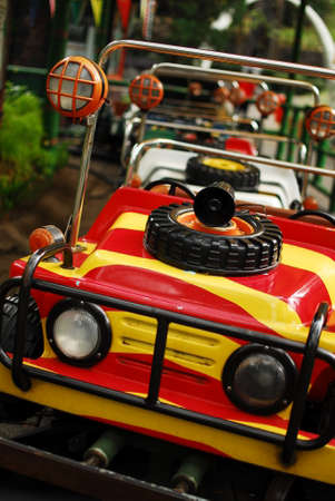Kids ride toy car red and yellowの写真素材