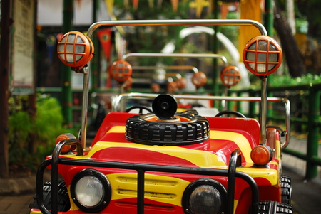 Kids ride toy car red and yellowの写真素材