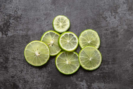 Piece of slide lemon on black background.の写真素材