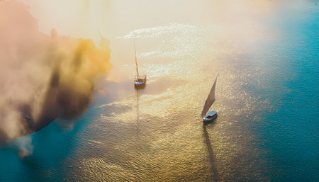 Aerial view of sailing boats on the sea in sunset light.の写真素材