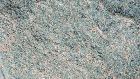 the texture of the river stone left by the roadside is the background for taking picturesの写真素材