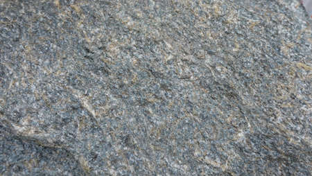 the texture of the river stone left by the roadside is the background for taking picturesの写真素材