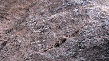 the texture of the river stone left by the roadside is the background for taking picturesの写真素材