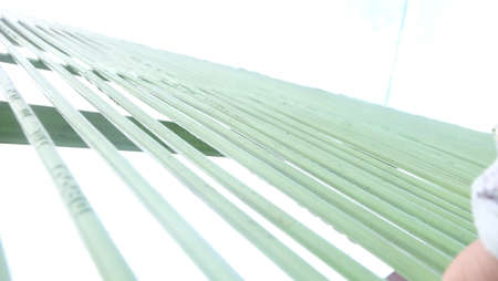 The fence of the house stands proudly against the background of the blue sky during the day.の写真素材