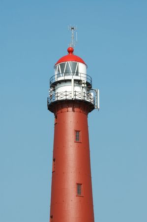 lighthouse against a blue skyの写真素材