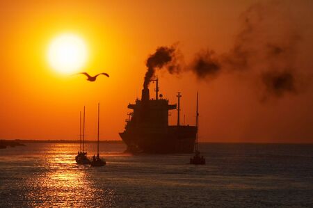 sunset and ships in the harborの写真素材