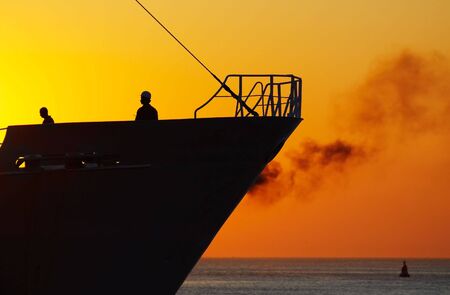 sunset and ships in the harborの写真素材