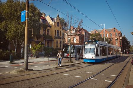 A tram in amsterdam near the rijksmuseumのeditorial素材