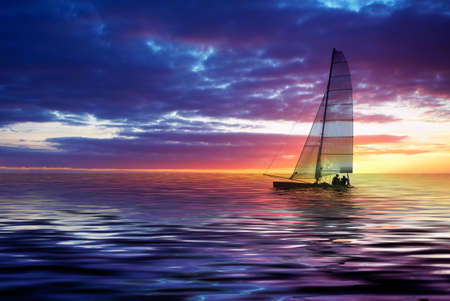 Sailboat against a beautiful sunsetの写真素材